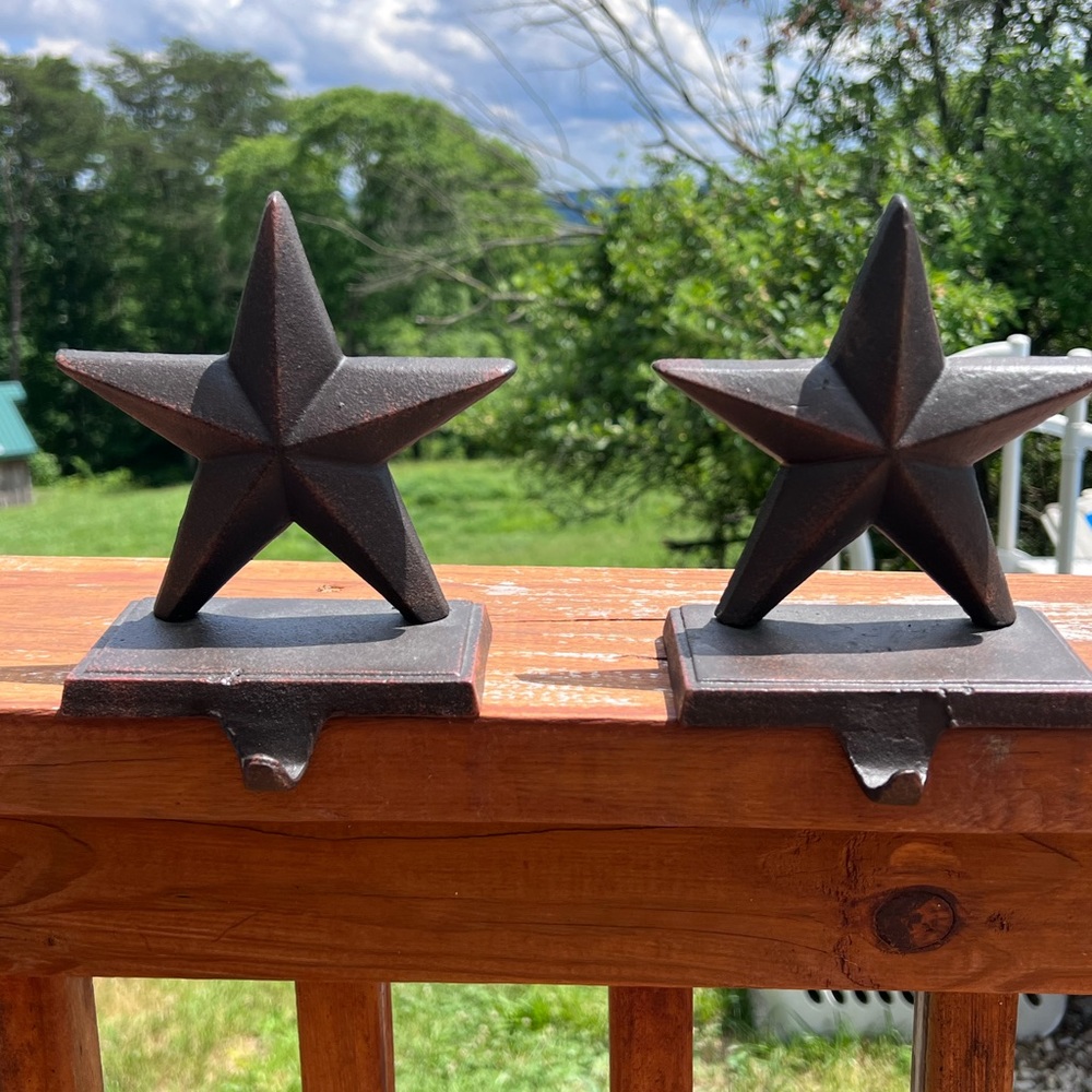 Vintage cast iron country star hangers.